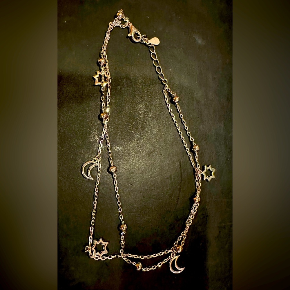 New silver ankle bracelet with stars and moons in box.